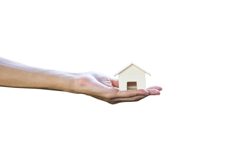 cropped-of-man-hand-holding-or-giving-small-house-isolated-on-white-background-include-clipping-path_t20_jodXJp